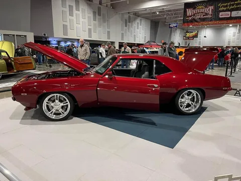Driver side of the Camaro at an indoor car show